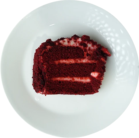 Morales Pizzeria red velvet cake slice on a white plate
